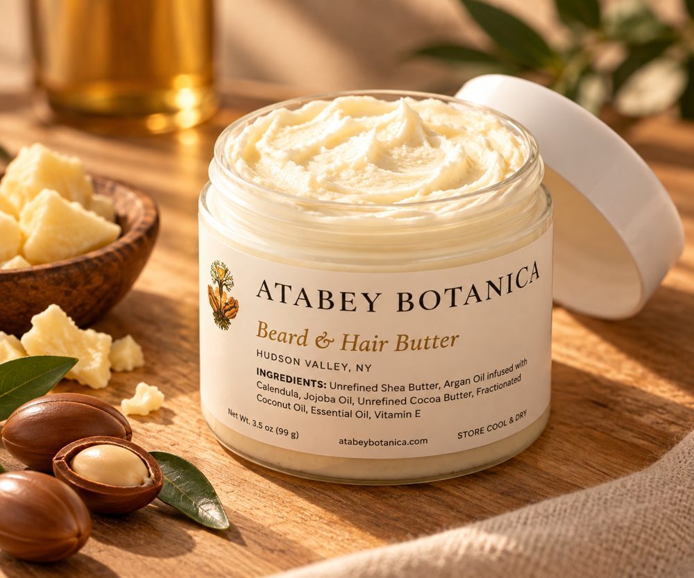 Open jar of Atabey Botanica Beard and Hair Butter with argan nuts and shea butter